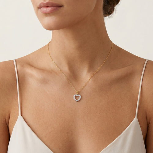 Gold heart with diamonds pendant
