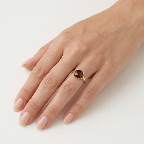 Garnet cushion cut in V prong setting