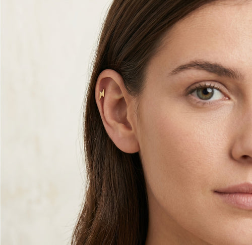 Elegant gold thunder design piercing