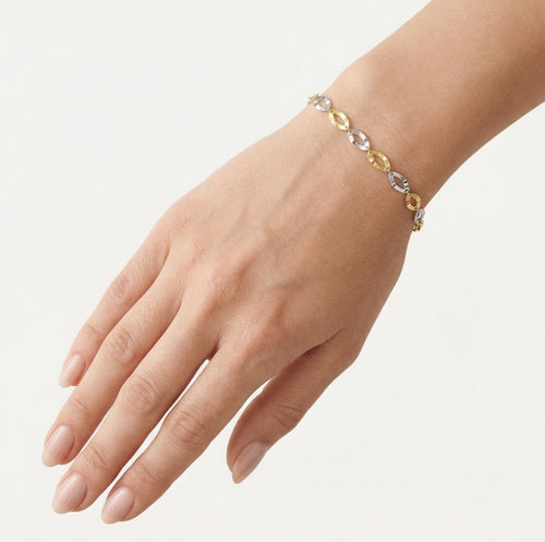 Two-colored gold bracelet with round article