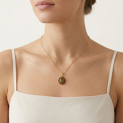 Celestial Harmony Pendant in Yellow Gold with Oval Moldavite and Round Garnet