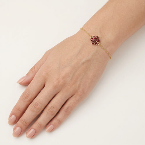 Garnet flower bracelet in yellow gold