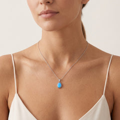 Oval cut blue opal white gold pendant
