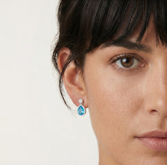 Halo sterling silver drop earrings with blue topaz