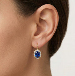 Oval blue quartz in gold earrings