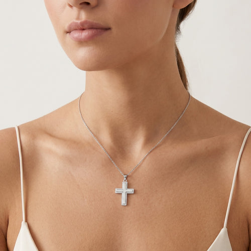 Sterling silver cross pendant featuring cubic zirconia