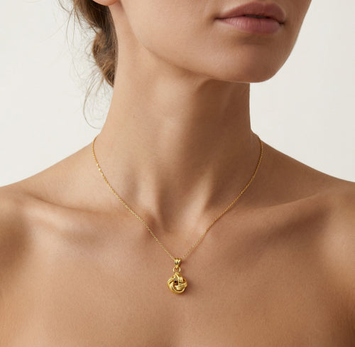 Yellow gold high polished knot pendant