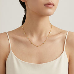 Gold necklace with multiple round zircons