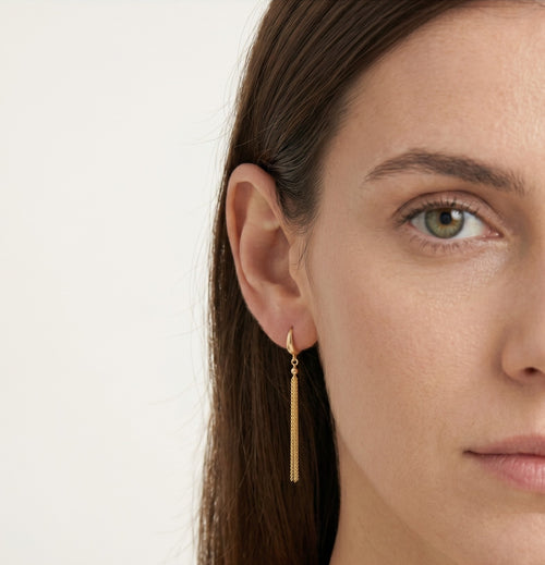 Delicate gold dangle earrings with chains