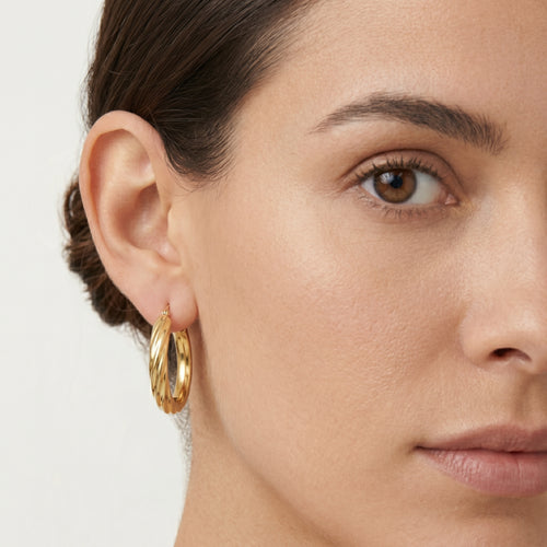 Yellow gold oval hoop earrings