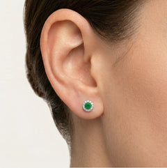 Silver earrings with synthetic emerald and surrounding cubic zirconia