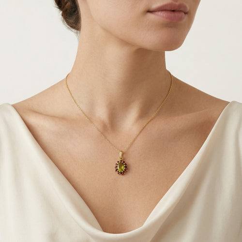Royal Radiance in Gelbgold mit ovalem Moldavit und rundem Granatstein