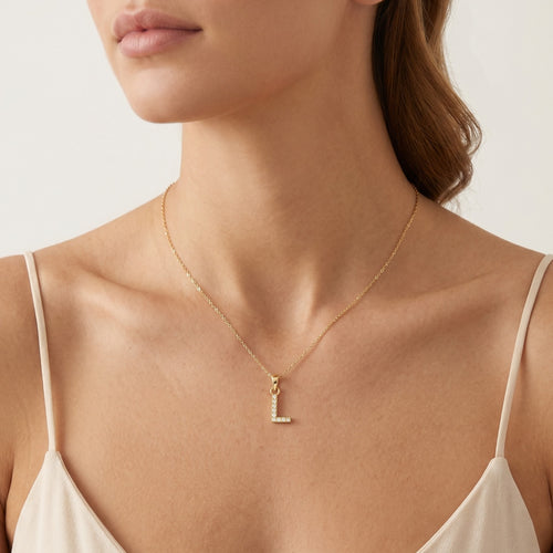 Zlatý přívěsek písmena "L" se zirkony