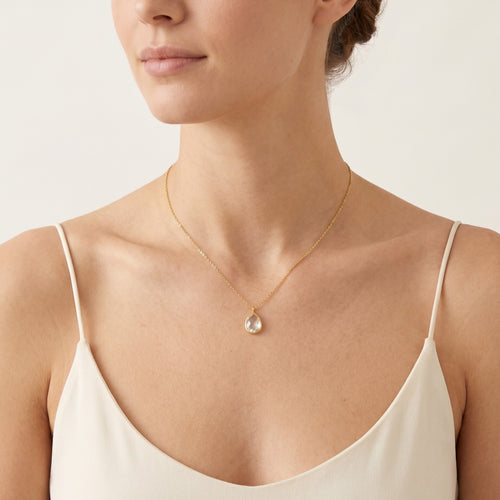 Gold necklace with pear cut zircon