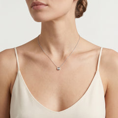 Necklace with diamond in round pendant
