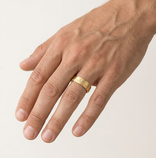 Yellow gold wedding ring with carved line detail