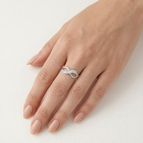 White gold infinity ring with cubic zirconia
