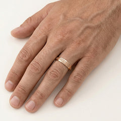 Rose gold wedding ring with greek pattern