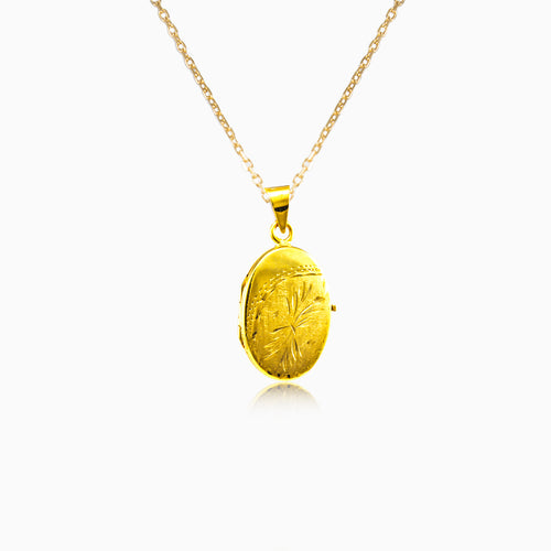 Gold oval medallion with patern
