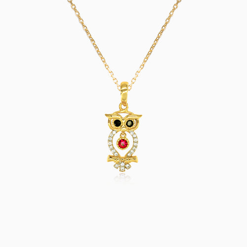 Gold pendant with an owl with zircons