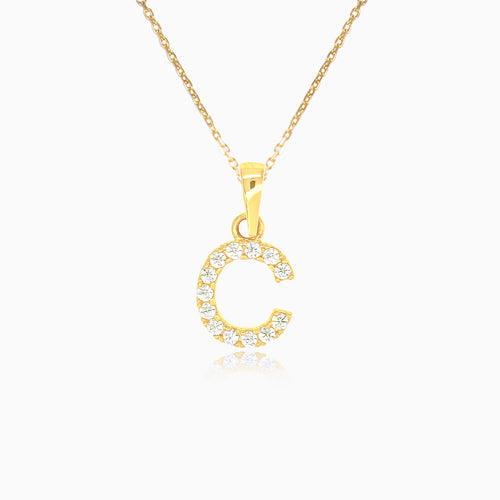 Gold pendant of letter "C" with zircons