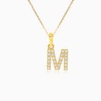 Gold pendant of letter "M" with zircons