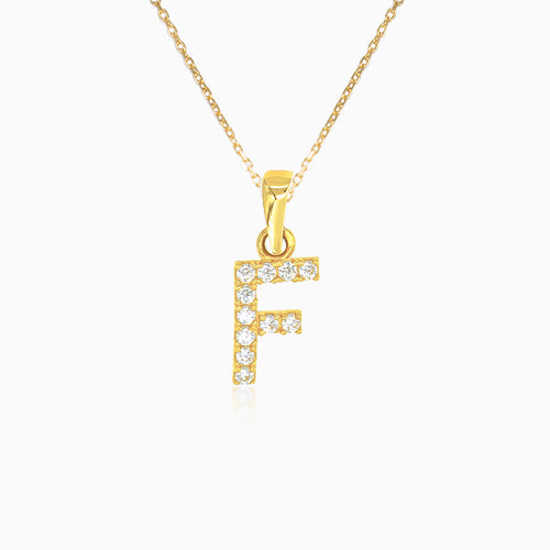 Gold pendant of letter "F" with zircons