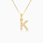 Gold pendant of letter "K" with zircons