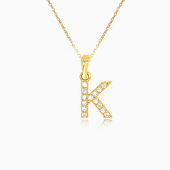 Gold pendant of letter "K" with zircons