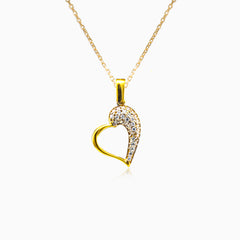 Gold heart with cubic zirconia on one side