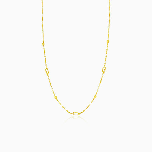 Gold necklace with balls and rectangular zircons