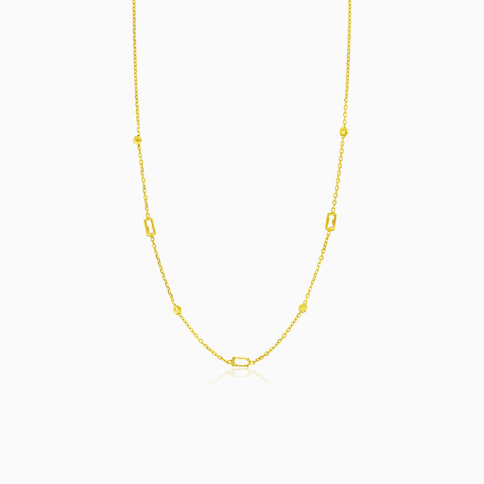 Gold necklace with balls and rectangular zircons