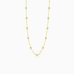 Gold necklace with multiple round zircons