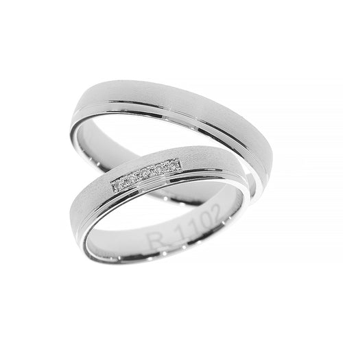 Matte white gold wedding band with diamonds