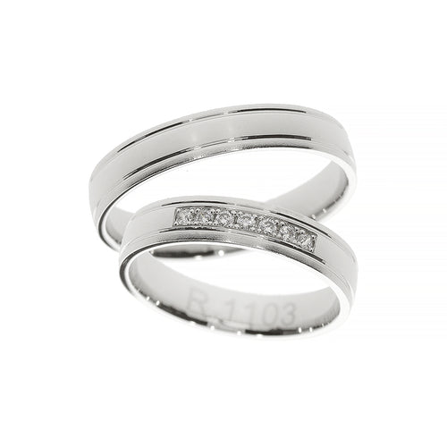 White gold polished wedding ring with diamonds