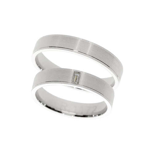 White gold wedding ring with bezel set and baguette stone