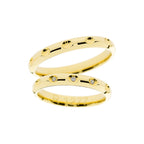 Yellow gold wedding ring with holes