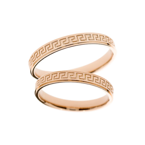 Rose gold wedding ring with symbols