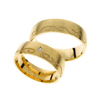 Yellow gold wedding ring with carved line detail