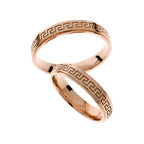 Rose gold wedding ring with greek pattern