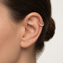 Piercing en or avec zircons en ligne