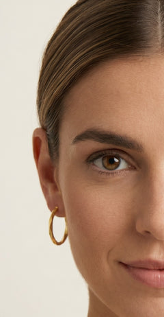 Twisted yellow gold hoop earrings