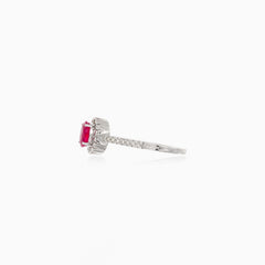 White gold ruby ring with diamond halo