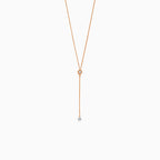 Rose gold necklace with dangling diamond