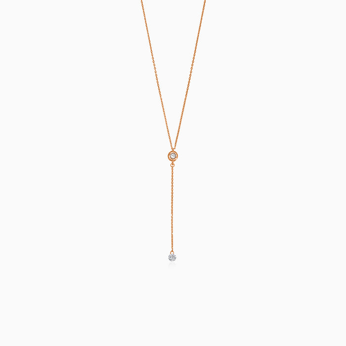 Rose gold necklace with dangling diamond