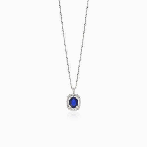Elegant white gold necklace with diamond and blue sapphire accents