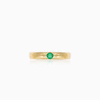 Simple gold ring with small emerald