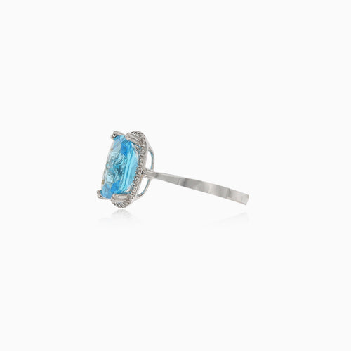 Bright white gold ring with topaz and diamonds