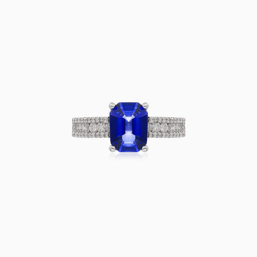 Stylish women's ring with diamonds and blue sapphire