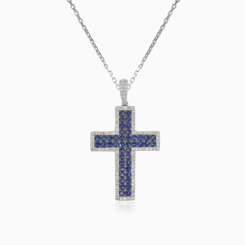 Elegant cross pendant with diamonds and blue sapphires